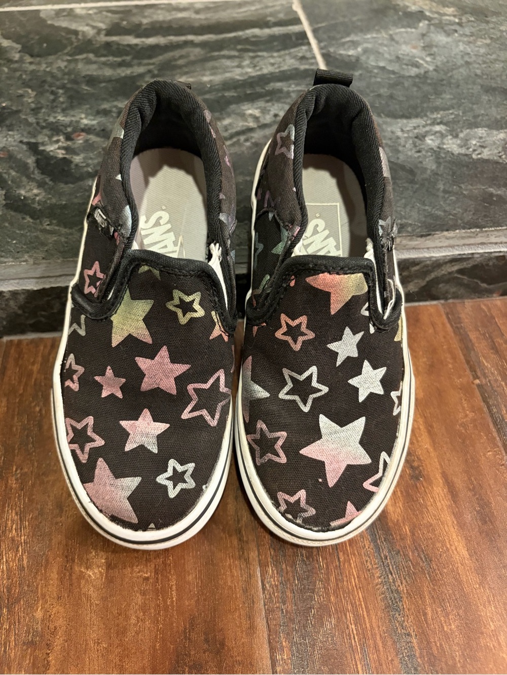 Vans Kids Slip-On Sneakers in Black with Pastel Star Print